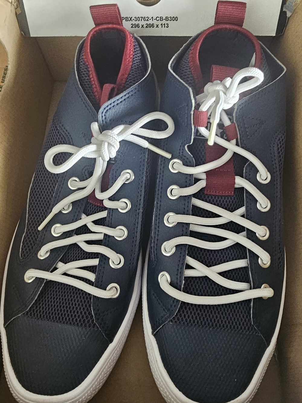 Converse Navy Blue High-Top Sneakers with White Laces and Red Accents